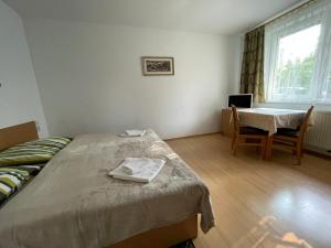 Postel nebo postele na pokoji v ubytování Privat HOTOS