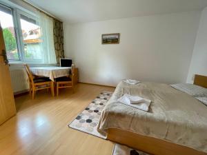 Postel nebo postele na pokoji v ubytování Privat HOTOS
