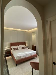 A bed or beds in a room at NoOne Tropea Guesthouse