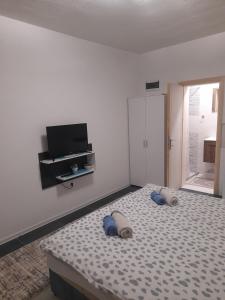 a bedroom with a bed with two pillows on it at Apartmani Pejovic in Mojkovac