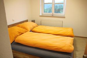 Posteľ alebo postele v izbe v ubytovaní Ferienhaus Kühlwein