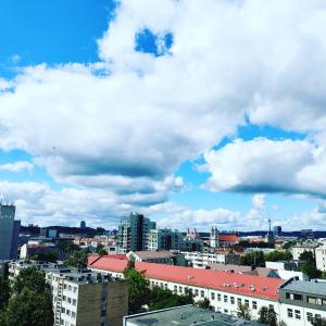 a view of a city under a cloudy sky at 9th floor Amazing View Central Studio Apartment in Vilnius