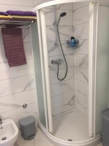 a bathroom with a shower and a sink at Apartments Joka 487 in Rovinj