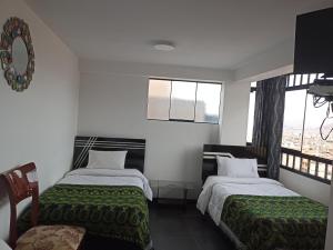 Hostal Killaly Inn Cusco客房内的一张或多张床位
