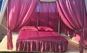 Uma cama ou camas num quarto em Vila Medo