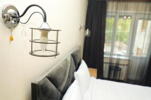 Voodi või voodid majutusasutuse Aragast Hotel & Brewery toas
