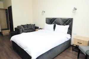 Voodi või voodid majutusasutuse Aragast Hotel & Brewery toas