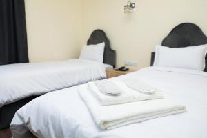 Voodi või voodid majutusasutuse Aragast Hotel & Brewery toas