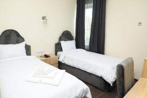 Voodi või voodid majutusasutuse Aragast Hotel & Brewery toas