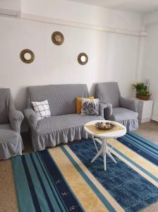 a living room with two couches and a coffee table at Sun & Sea 3 Bedroom Apartment de Grau in Gandía