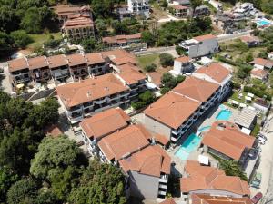 an overhead view of a group of buildings with a pool at enJOY Golden beach in Skala Potamias