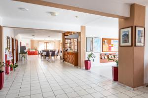 a hallway with a dining room and a living room at Casa Garden in Karpathos