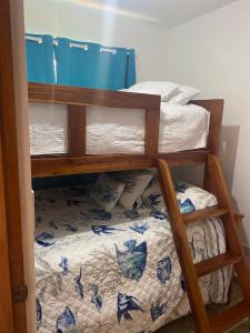 a bunk bed in a room with a bunk bedutenewayewayangering at Beachfront Apartment, Quiet 4 Beds, 1 Bath, AC, Wi-Fi, Hot Water, in Paraiso near Los Patos in Paraíso