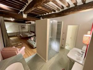 a bathroom with a shower and a toilet and a sink at Il Casale Denari in Santa Maria della Versa