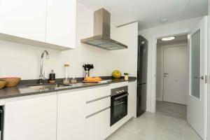 Kuchyň nebo kuchyňský kout v ubytování Apartamento de lujo de un dormitorio