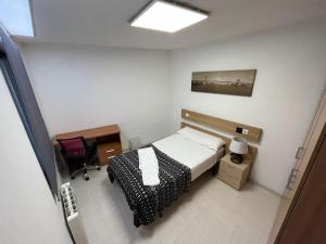 Łóżko lub łóżka w pokoju w obiekcie Residencia Vista Alegre