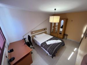 Łóżko lub łóżka w pokoju w obiekcie Residencia Vista Alegre