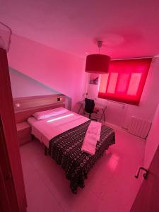 Łóżko lub łóżka w pokoju w obiekcie Residencia Vista Alegre