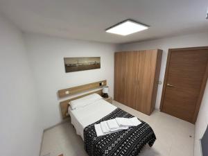 Łóżko lub łóżka w pokoju w obiekcie Residencia Vista Alegre