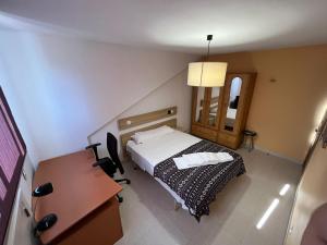 Łóżko lub łóżka w pokoju w obiekcie Residencia Vista Alegre
