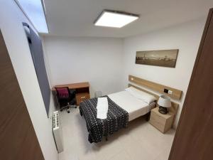 Łóżko lub łóżka w pokoju w obiekcie Residencia Vista Alegre