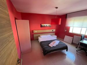 Łóżko lub łóżka w pokoju w obiekcie Residencia Vista Alegre