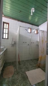 a bathroom with a shower and a sink at Sítio Cumuru in Paraty +34 photos
