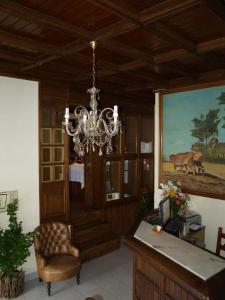 a living room filled with furniture and decorations at Hotel Tic Tac in Bragança