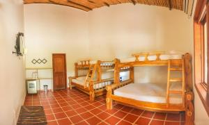 Postel nebo postele na pokoji v ubytování Hotel Brisas La Gaviota Mariquit-Tolima
