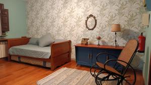 A bed or beds in a room at Casa Joglar