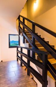 a staircase in a house with wooden floors at Pensiunea Soarelui in Fundata