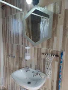 a bathroom with a sink and a mirror at Mi casa in Salta