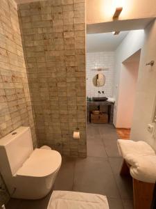 a bathroom with a toilet and a sink at Vila Lobo Algarve in Faro