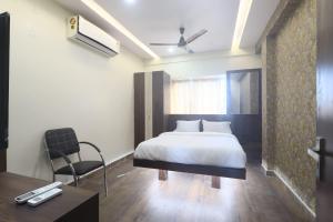 Hotel Sohrai Inn客房内的一张或多张床位