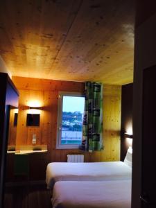 Postel nebo postele na pokoji v ubytování Fasthotel Dunkerque