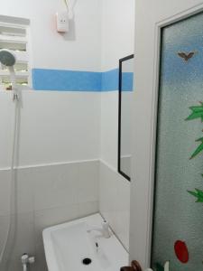 a bathroom with a sink and a shower at RedDoorz @ Isla Virginia Beach Resort Aurora Baler in Baler