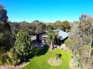 an aerial view of a house in the woods at Bellshala bungalow in Bellbrae