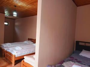 Katil atau katil-katil dalam bilik di Guesthouse and Cottage Nicolo
