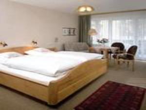 Ένα ή περισσότερα κρεβάτια σε δωμάτιο στο Kurhotel Eichwaldeck