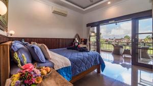 Postel nebo postele na pokoji v ubytování Kun - Kun Guest House Ubud
