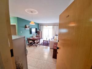 a room with a kitchen and a dining room at Dock Holiday Apartment in Larnaka