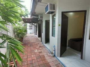 a hallway of a building with a brick walkway at South Breeze Balibago 3 minutes away from Santa Rosa Commercial Complex in Macabling