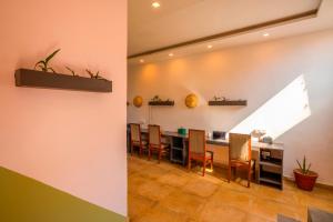 a dining room with a table and chairs at Zostel Banikhet (Dalhousie) in Dalhousie