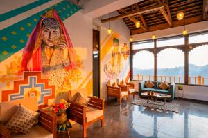 a lobby with a mural of a goddess at Zostel Banikhet (Dalhousie) in Dalhousie