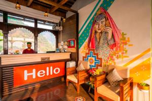 a restaurant with a hello mural on the wall at Zostel Banikhet (Dalhousie) in Dalhousie +29 photos
