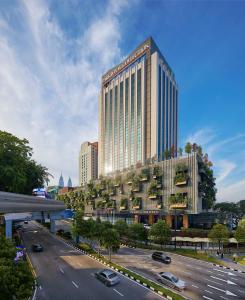 a rendering of a large building with a parking lot at PARKROYAL COLLECTION Kuala Lumpur in Kuala Lumpur