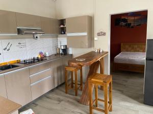a kitchen with a wooden counter top in a room at City Apartments in Port Louis