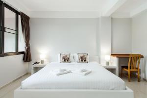 Postel nebo postele na pokoji v ubytování Prinz Garden Villa
