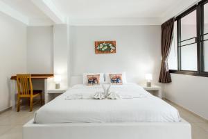 Postel nebo postele na pokoji v ubytování Prinz Garden Villa