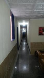 a hallway of a building with a long corridor at Parque Hotel in Rio de Janeiro